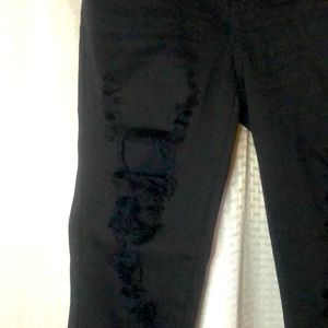 Black distressed skinny jeans.